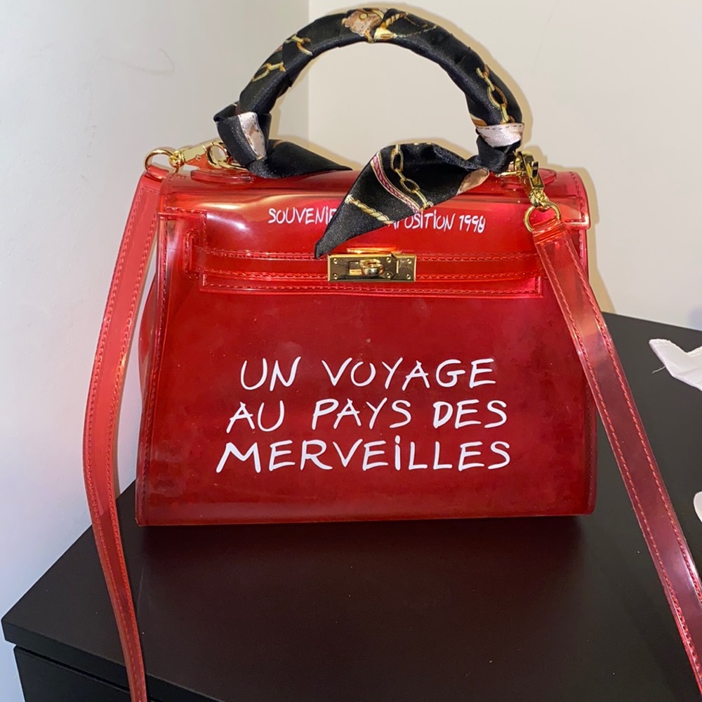 See-through pink handle bag